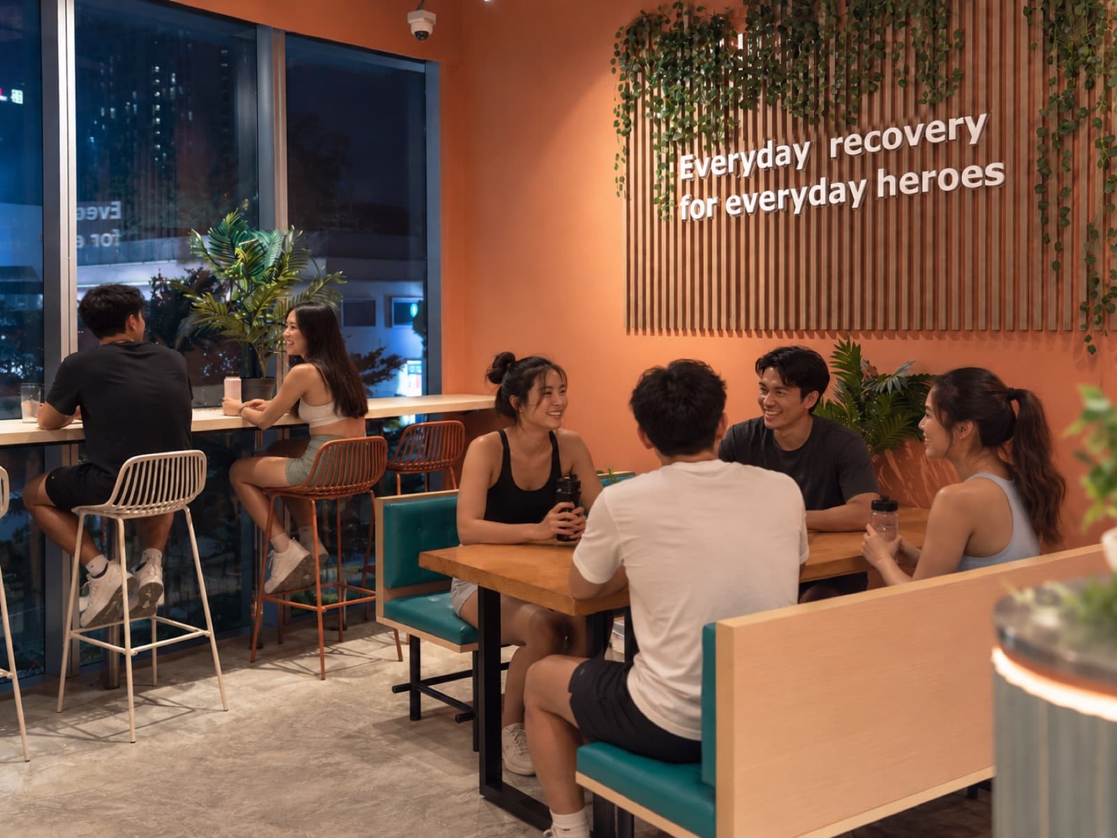 A team catching up over drinks in the SOCHILL cafe after a session