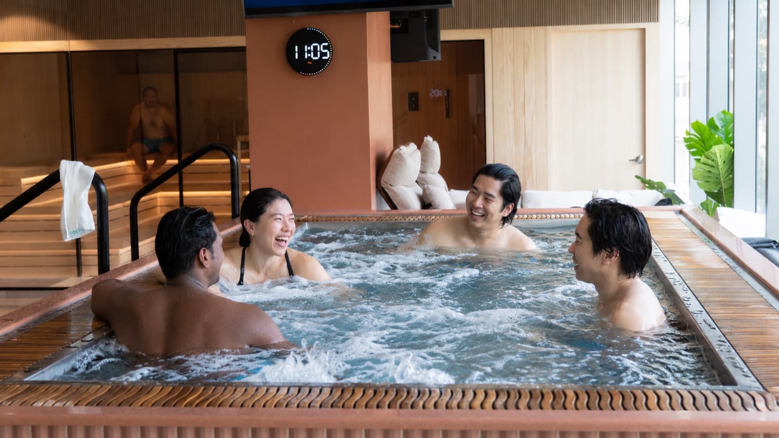 Friends laughing together in the Sochill hydrotherapy bath